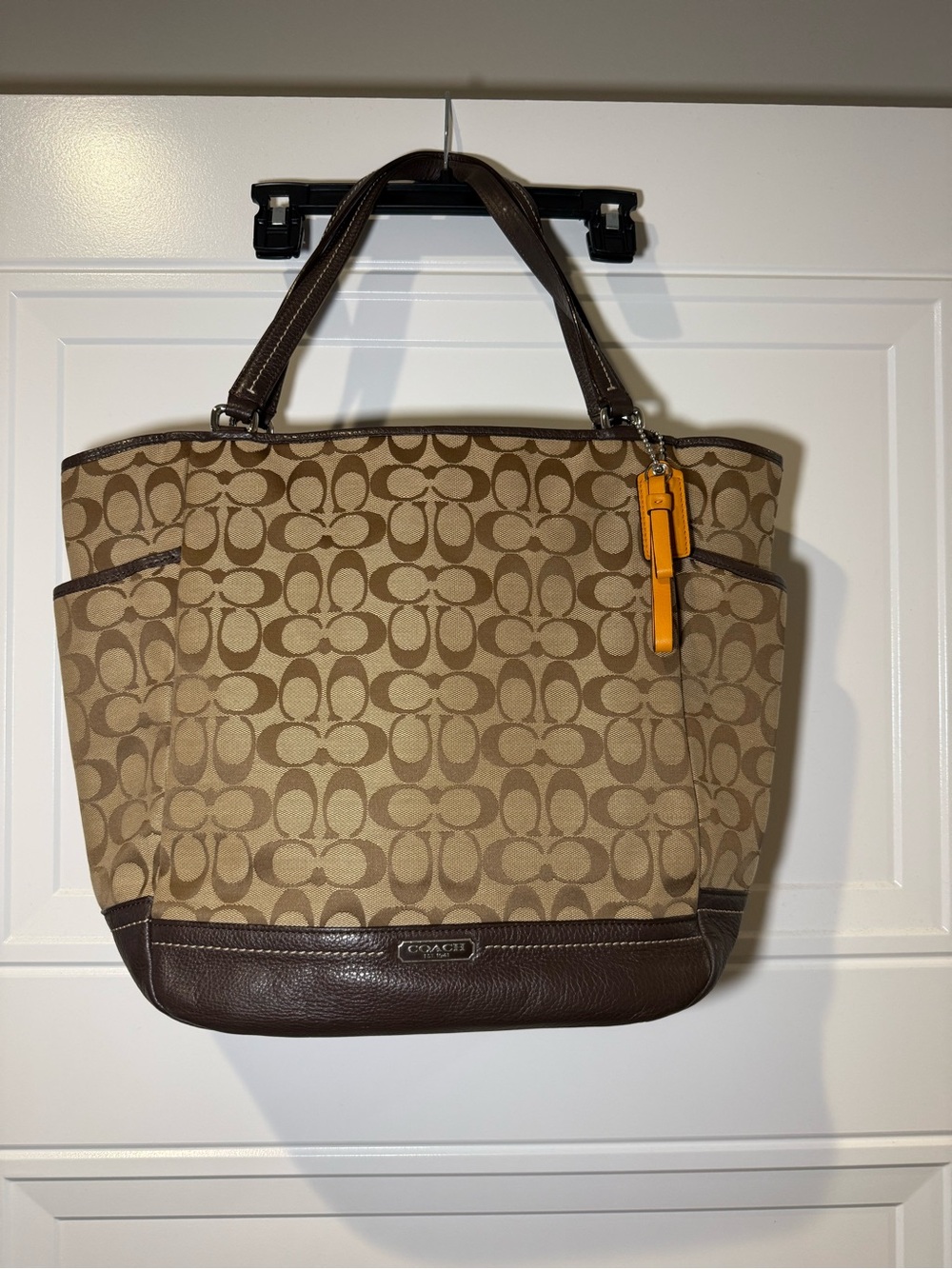 Coach Tan Signature Canvas Tote with Brown Leather and Orange Charm